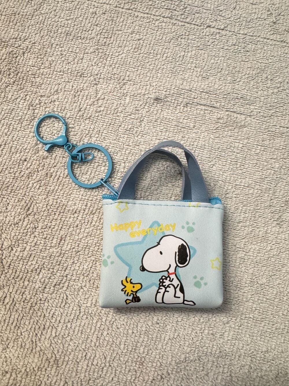 Snoopy mini purse keychain with zipper with Snoopy and Woodstock graphic